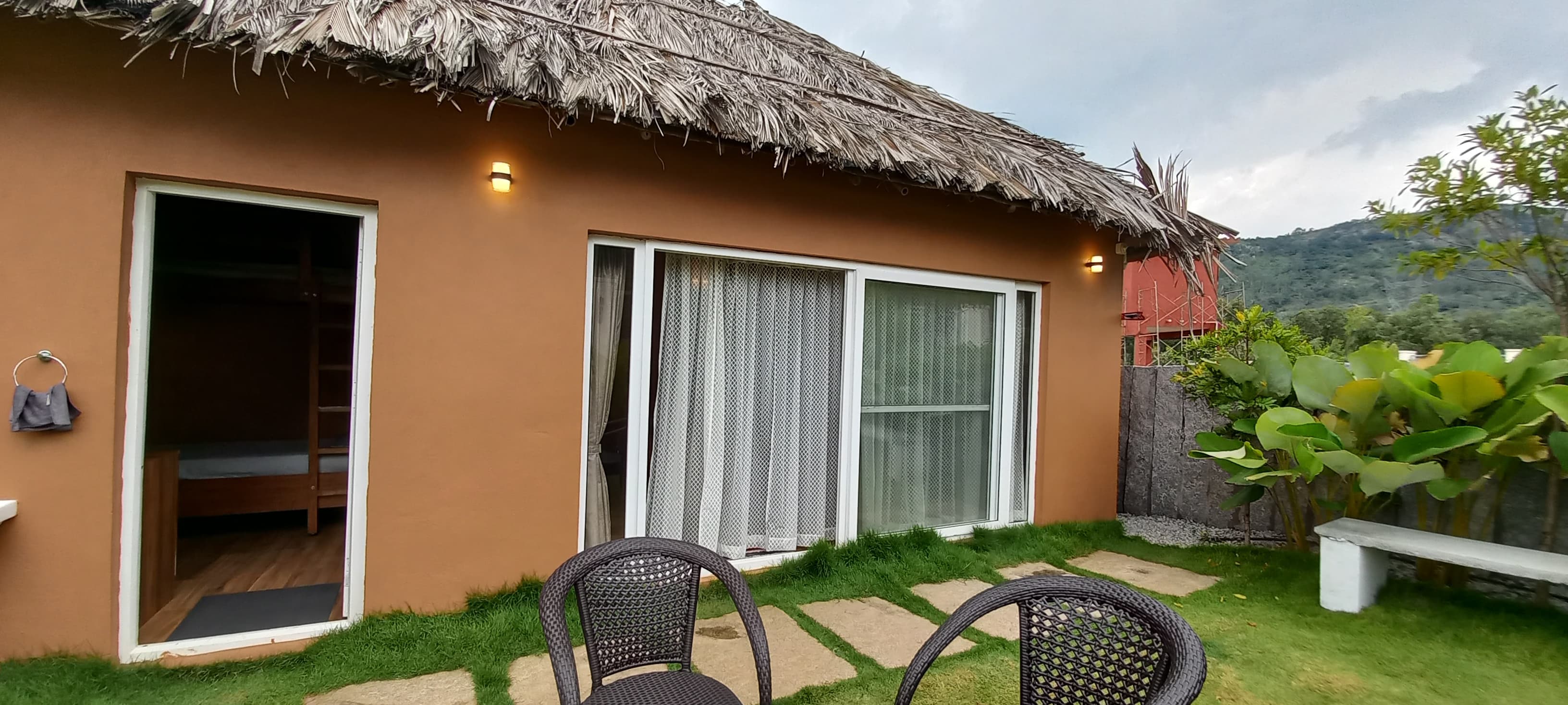 Villa exterior with thatched roof